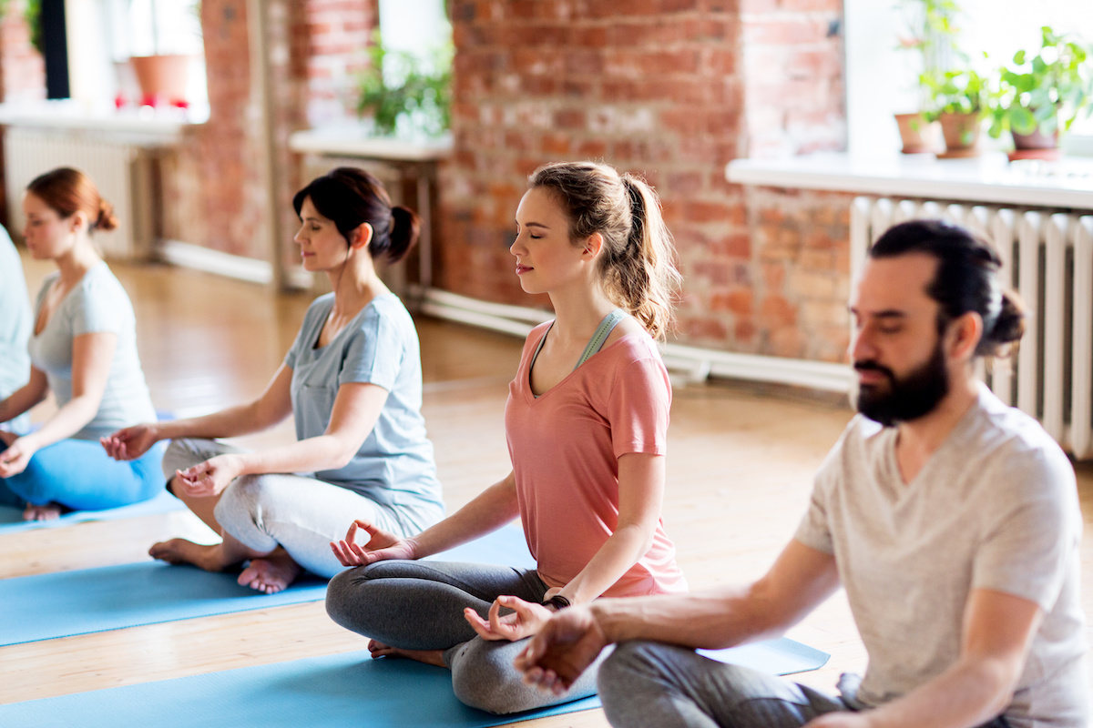 Yoga students practicing pranayama (breath work)